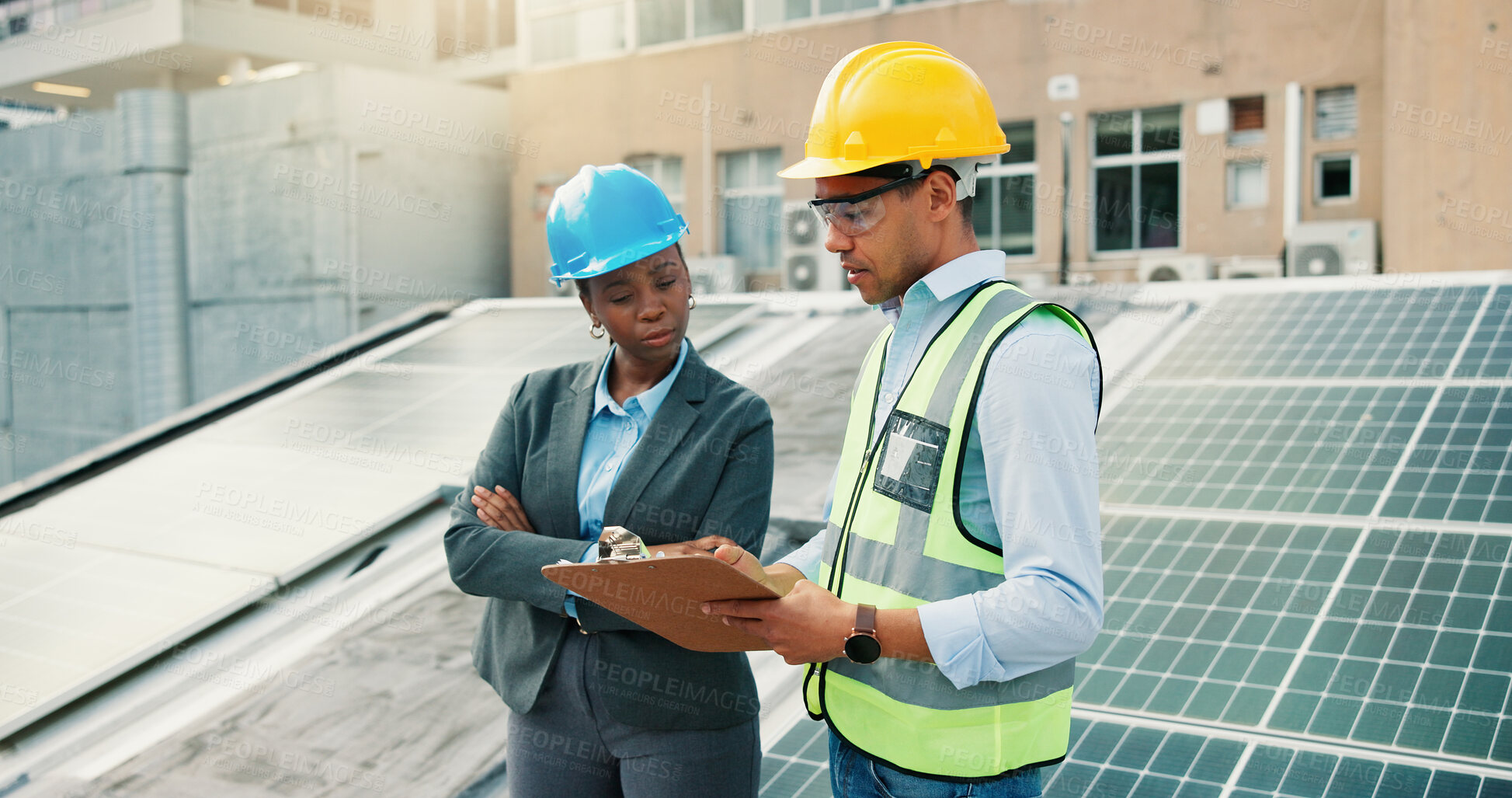 Buy stock photo Clipboard, planning and solar energy with construction worker people on building roof for inspection. Architecture, collaboration or conversation with team outdoor to install photovoltaic panels
