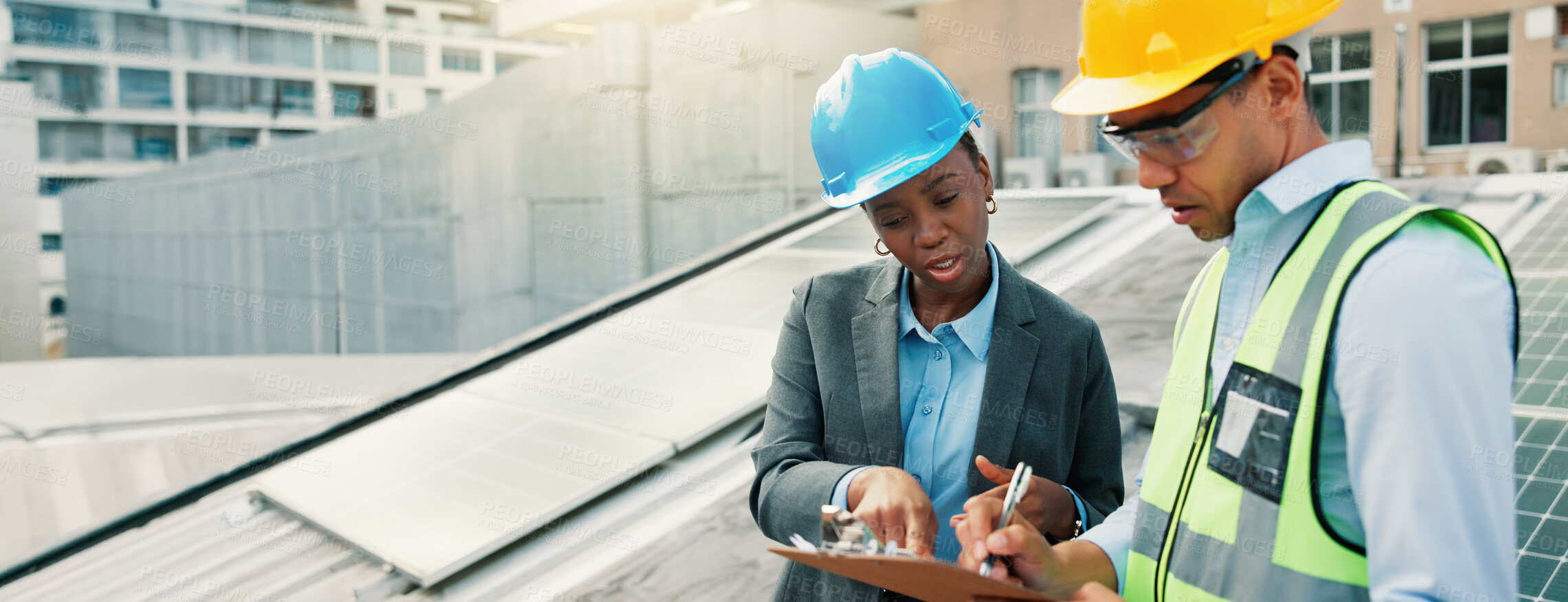 Buy stock photo Clipboard, conversation and solar energy with construction worker people on building roof for inspection. Architecture, collaboration or planning with team outdoor to install photovoltaic panels