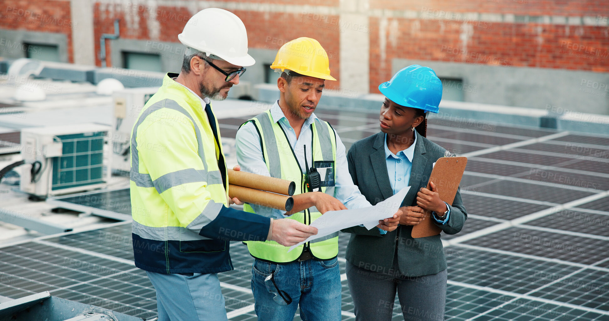 Buy stock photo Solar panel, team of people and plan outdoor for clean energy, renewable resource or paperwork for inspection. Engineer group, meeting and photovoltaic installation check with document on rooftop