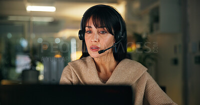 Buy stock photo Woman, headset and call center with discussion at night, customer support and advice at office. Person, consultant and agent with voip mic, problem solving or contact us at help desk in workplace