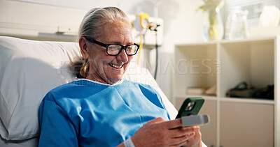 Buy stock photo Phone, relax and senior woman in hospital with networking, communication or social media. Happy, technology and elderly female person with cellphone for chatting online in ward at medical clinic.