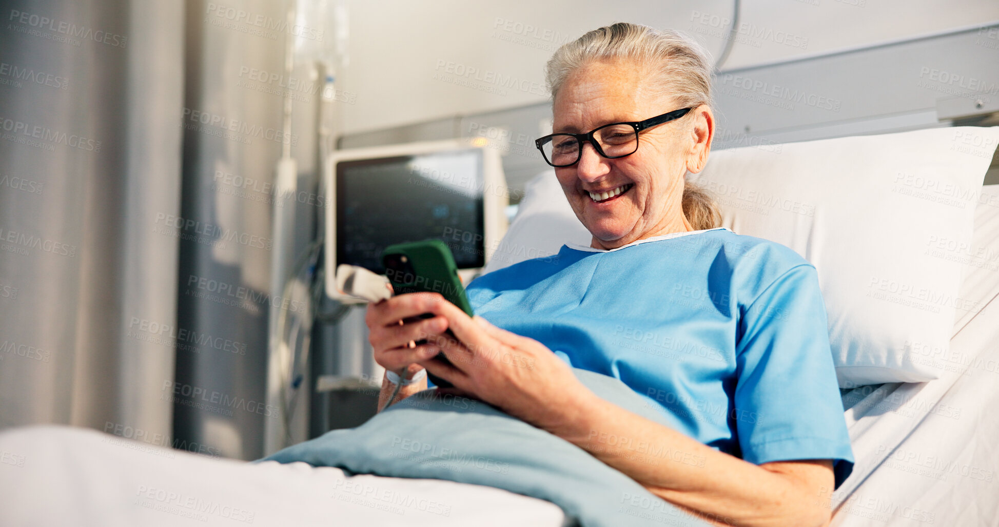 Buy stock photo Smartphone, patient and old woman in hospital bed, smile or message to contact, internet and app. Recovery, pensioner or elderly person in clinic, cellphone or social media with healthcare or healing
