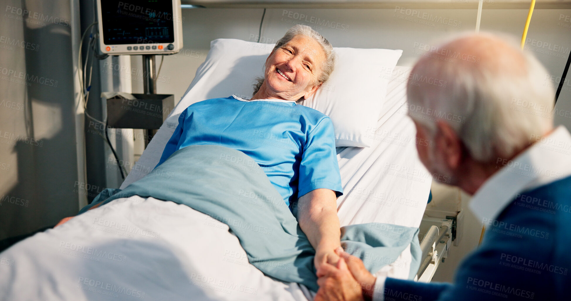 Buy stock photo Happy, visit and senior woman in hospital with husband for bonding, support or care in recovery. Medical appointment, marriage and elderly female patient in ward bed for consultation in clinic.