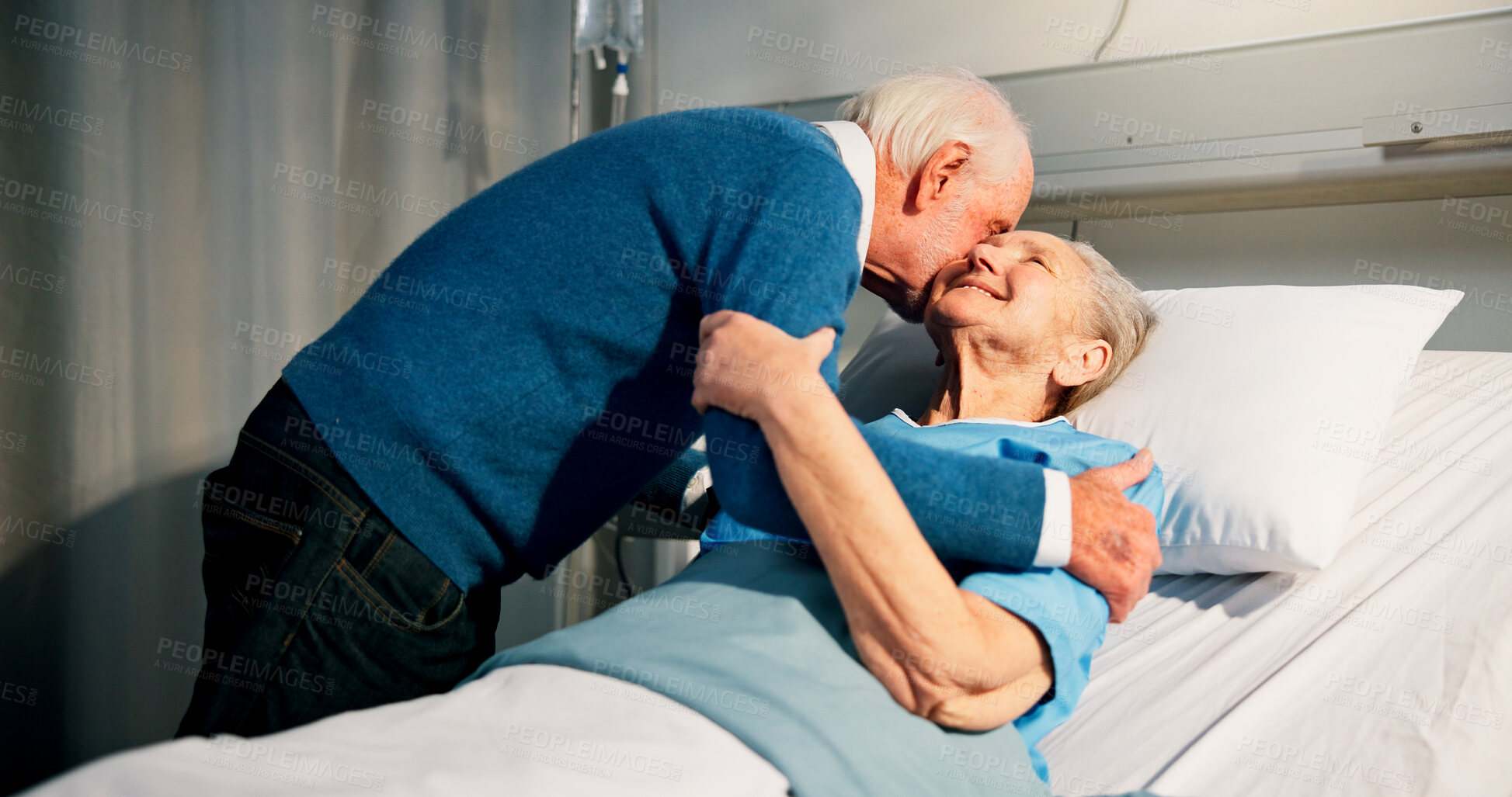 Buy stock photo Kiss, visit and senior woman in hospital with husband for bonding, support or care in recovery. Retirement, marriage and elderly patient in ward bed with empathy for connection in medical clinic.
