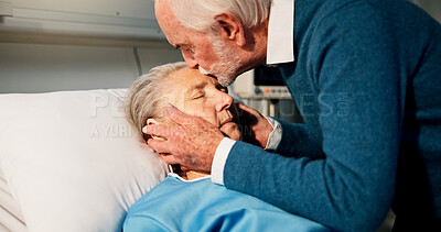 Buy stock photo Senior man, woman and kiss in hospital bed with sleeping, greeting and love for recovery in retirement. Old couple, patient and partner with kindness, support and embrace for rehabilitation at clinic