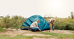 Tent, help and couple with nature, teamwork and assistance with adventure, support and setting up. Camping, man or woman with preparation, cooperation or explore with recreation or vacation in Canada