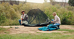 Tent, help and couple with teamwork, wilderness and assistance with adventure, support and break. Camping, man and woman with preparation, setting up and nature with recreation and holiday in Canada