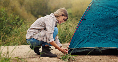 Buy stock photo Tent, setting up and woman with nature, vacation and recreation with tourism, adventure and skills. Camping, traveller and person with environment, countryside and assemble with equipment in Canada