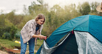 Woman, camping and pitch tent in nature, gear and rope for safety on holiday adventure in summer. Girl, knot and equipment with fabric for shelter construction on vacation, tourism or getaway in bush