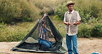 Couple, building and tent for camping in nature for travel gear, vacation adventure and bonding together. People, help and setup equipment as outdoor shelter, campsite preparation and holiday getaway
