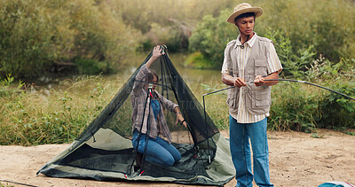 Buy stock photo Couple, building and tent for camping in nature for travel gear, vacation adventure and bonding together. People, help and setup equipment as outdoor shelter, campsite preparation and holiday getaway