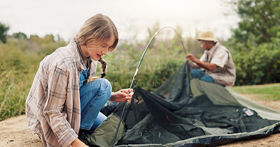 Buy stock photo Couple, pitching and tent for camping in nature for travel gear, vacation adventure and bonding together. People, help and setup equipment of outdoor shelter, campsite preparation and holiday getaway