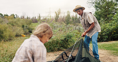 Buy stock photo Man, woman and pitching tent in nature for camping, vacation adventure and bonding together. Couple, partner helping or setup equipment as outdoor shelter, campsite preparation and wilderness holiday