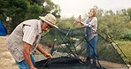 Couple, building and tent for camping outdoor for travel gear, vacation adventure and bonding together. People, helping and setup equipment as nature shelter, campsite preparation and holiday getaway