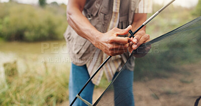Buy stock photo Hands, man and building tent for camping adventure, travel preparation and holiday in wilderness. Person, setup cable and equipment to assemble shelter, pitching skills and vacation safety in nature