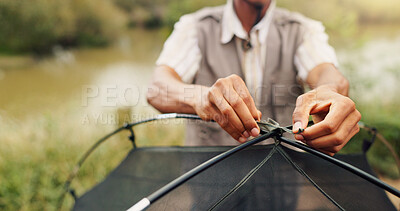 Buy stock photo Hands, man and pitching tent for camping adventure, travel preparation and holiday in wilderness. Person, tying cable and equipment to assemble shelter, survival skills and vacation safety in nature