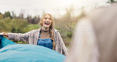 Buy stock photo Smile, woman and pitching tent in nature for camping, vacation adventure and bonding together. Couple, partner help and setup equipment as outdoor shelter, campsite preparation and wilderness holiday