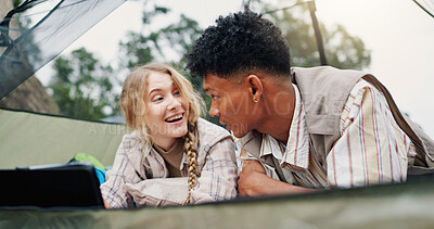 Buy stock photo Camping, relax and tablet with couple in tent together for environmental conservation or research. App, break and sustainability with happy people at campsite for bonding, ecology or love of nature