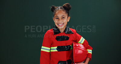 Buy stock photo Happy girl, portrait and firefighter with helmet in studio for career day on a green background. Child, kid or smile with costume or outfit for school play, junior rescue or safety on mockup space