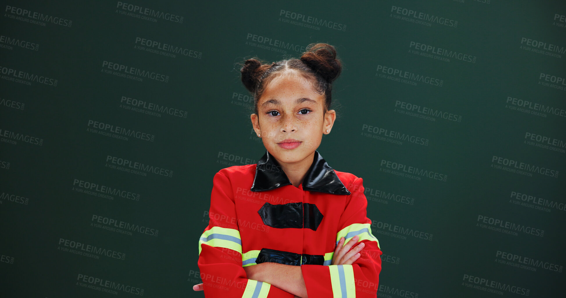 Buy stock photo Girl, portrait and firefighter with confidence in studio for career day on a green background. Serious, child or kid with arms crossed in costume or outfit for help, safety or rescue on mockup space