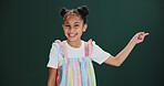 Studio, portrait and child with news, pointing and happy for presentation, discount or mockup space. Green background, advertising and girl with positive attitude for offer alert, deal and promotion