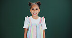 Happiness, student and girl in studio with portrait, education and learning on green background. Excited, smile or young female child in academy with mockup, space or growth for fashion in childhood
