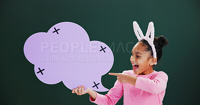 Buy stock photo Happy, pointing or girl with speech bubble, excited or announcement on green studio background. Kid, billboard or cloud space with card, promotion or offer info with feedback, social media or opinion