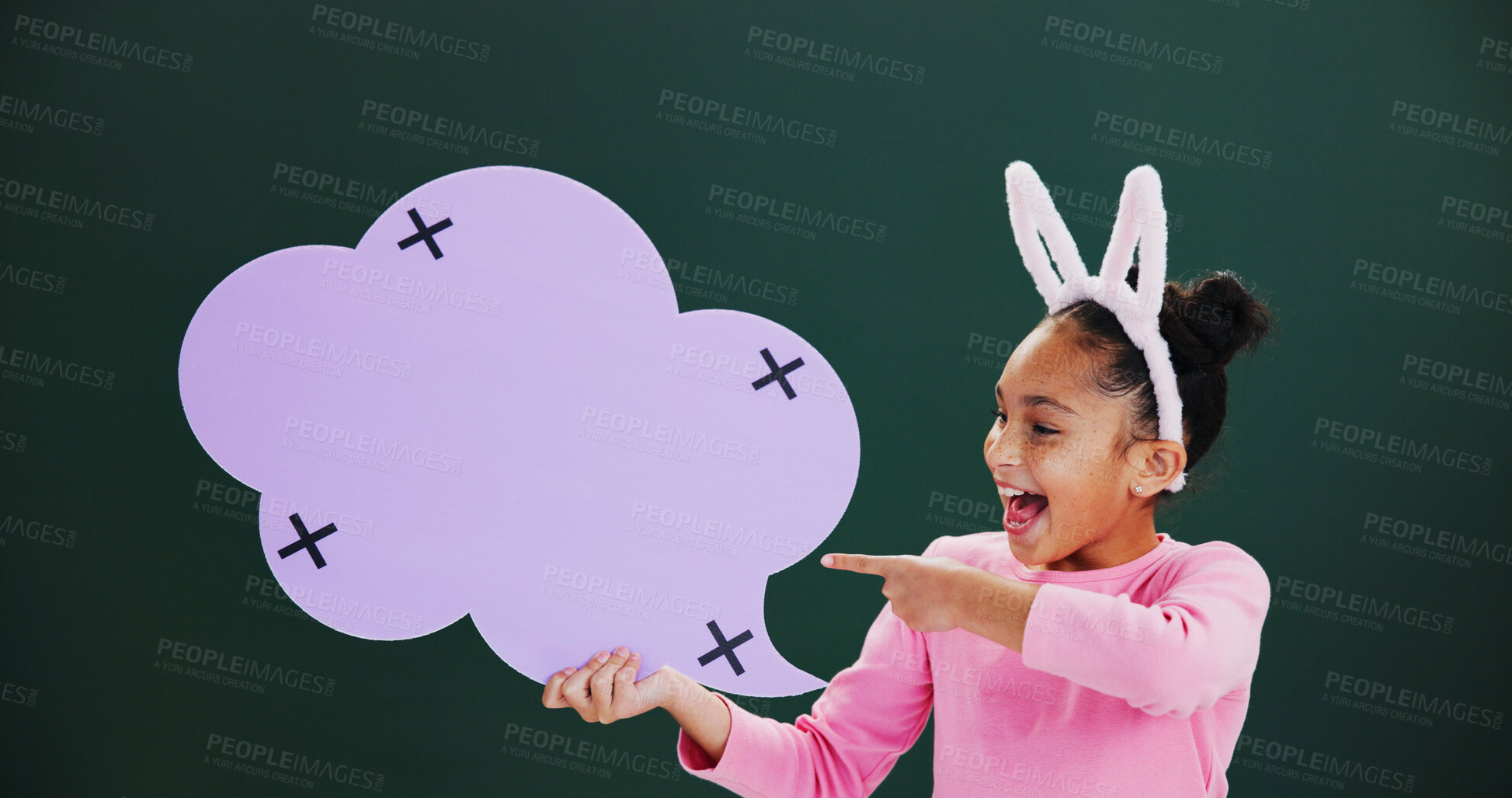 Buy stock photo Happy, pointing or girl with speech bubble, excited or announcement on green studio background. Kid, billboard or cloud space with card, promotion or offer info with feedback, social media or opinion