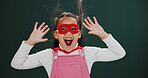 Portrait, superhero and girl in studio, excited and screaming on green background. Happiness, mask and child with fantasy, scifi and comic with character, surprise and Halloween with games or cosplay
