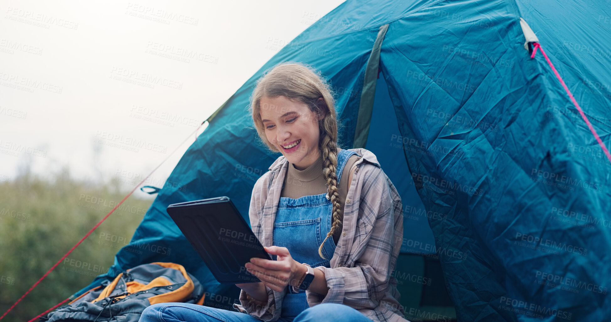 Buy stock photo Smile, woman and camping with tablet outdoor for research, watching movies and weather forecast. Person, reading or tent with digital on vacation, browsing internet and online entertainment in nature