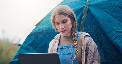 Buy stock photo Woman, camping and laptop with tent outdoor for remote work, writing blog and weather forecast. Female person, pc and relax for travel vacation, content creation and documenting adventure in nature