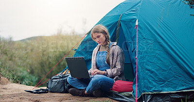 Buy stock photo Woman, camping and laptop with tent outdoor for research, watching movies and weather forecast. Female person, reading and pc for vacation break, browsing internet and online entertainment in nature