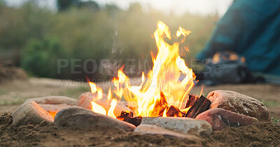 Buy stock photo Fire, wood and camp with tent for survival, outdoor flame or heat with rocks on campsite in nature. Campfire, burn or smoke with timber logs or shelter for light, safety or warmth in wilderness