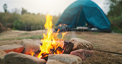 Buy stock photo Fire, wood and camp with tent for heat, survival or outdoor flame with rocks on campsite in nature. Campfire, burn or smoke with timber logs or shelter for light, safety or warmth in wilderness