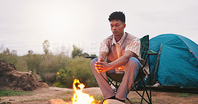 Buy stock photo Camping, man and relax by fire in nature for warmth, heating hands and holiday adventure. Countryside, travel freedom and person with campfire for vacation trip, eco friendly comfort and space