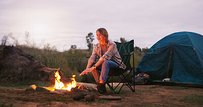 Buy stock photo Camping, woman and relax by fire in woods for heating hands, freedom and travel adventure. Countryside trip, dusk and person with campfire for vacation warmth, eco friendly holiday and mockup space