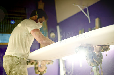 Buy stock photo Artisan, tools and person in workshop with surfboard, repair and working in industry. Production, startup and man in manufacturing with equipment, polish and smoothing for handmade surf product