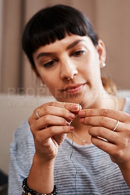Buy stock photo Woman, needle or thread with hand in workplace for creative business, startup tailor with fashion design. Female entrepreneur, cotton or sewing for change on clothes, skill with commitment for repair