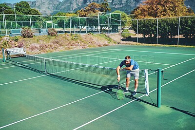 Buy stock photo Tennis, man and tired player at net with competition loss, fitness and exhausted at outdoor match. Sports, fatigue and frustrated athlete on court for workout, exercise and challenge in summer games