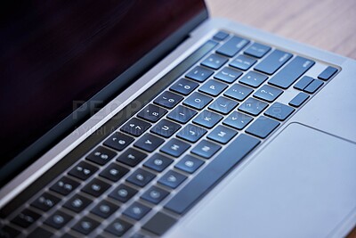 Buy stock photo Shot of a laptop on a desk in an empty office during the day