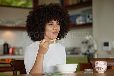 Buy stock photo Black woman, chopsticks and food for lunch in kitchen fine dining for healthy diet, experience or hunger. Female person, plate and asian cuisine or ramen in home for snack, nutrition and eating