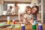 Creative, art and family painting at home for education, design and relax together for child development. Happy, inspiration and  sketch with mom and girl at table for learning, peace and motivation