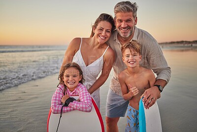 Buy stock photo Surfing, happy family on a beach for holiday outdoor wellness, healthy lifestyle and development with love, support and care. Parents or mother and father with kids portrait with surfboard by ocean