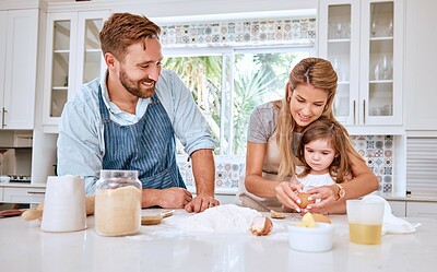 Buy stock photo Mother, father and girl cooking and baking in kitchen having fun, bonding and together. Family, love and parents teaching child to cook, bake and learning chef skills at home for child development