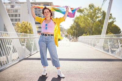 Buy stock photo Rainbow, flag and lgbt woman portrait of a person with human rights, sexuality and equality support. Freedom, smile and gen z female on a urban city bridge with celebration of lgbtq with happiness