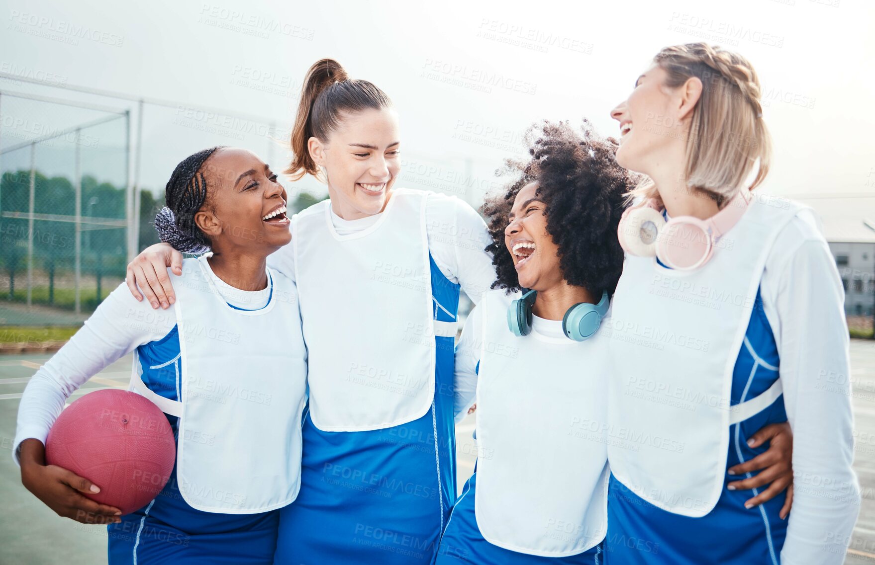 Buy stock photo Netball, team and friends laughing together, women on outdoor court and funny, sports and diversity. Happy athlete group, training for game and gen z with fitness and trust with support and humor