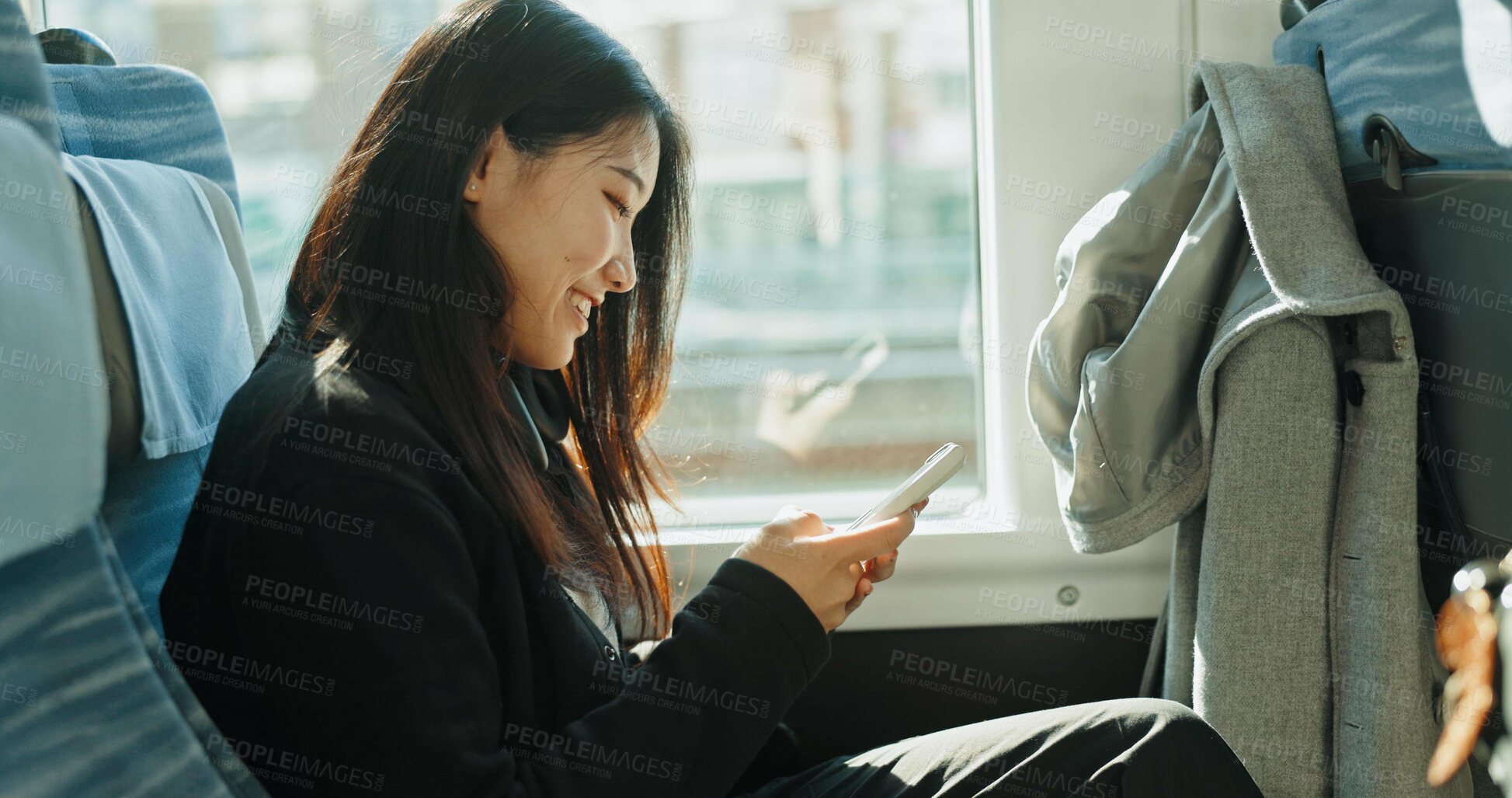 Buy stock photo Bus, travel and woman with a smartphone, smile and Japanese with commute, social media and connection. Person, transportation and girl with cellphone, mobile user and typing with communication or joy