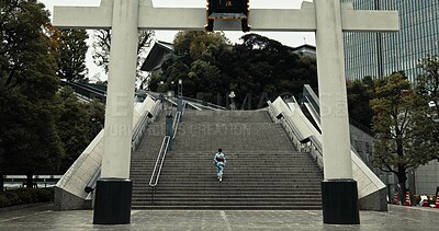 Buy stock photo Japan, woman and kimono in city on stairs for wellness, heritage celebration or culture in outdoor Tokyo. Sanno Torii, person or walking on steps for travel, spiritual journey and traditional fashion