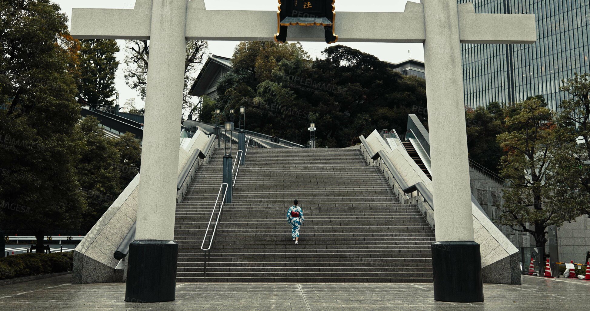 Buy stock photo Japan, woman and kimono in city on stairs for wellness, heritage celebration or culture in outdoor Tokyo. Sanno Torii, person or walking on steps for travel, spiritual journey and traditional fashion