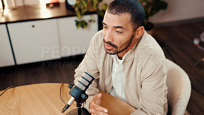 Buy stock photo Above, man and speaking with mic for podcast, audio broadcast and live recording in studio. Male presenter, explain and hosting talk show with media production, content creator and radio announcement